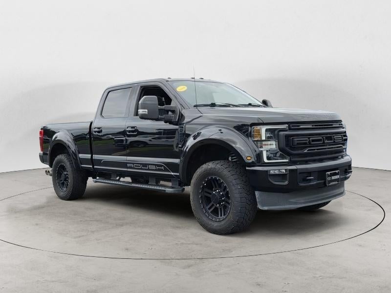 2021 Ford F-250 LARIAT in Agate Black Metallic — front three-quarter view